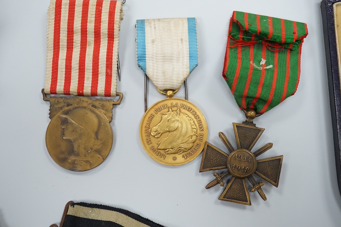 A quantity of assorted medals, an Essex crystal button, badges and ephemera
